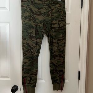 Level 99 camouflage pants Size 30. Cuffed hem with red zipper